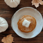 soft & fluffy pumpkin pancakes made with oat flour & maple syrup
